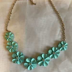 Light Blue Enamel and rhinestone center, flower necklace on a gold tone chain